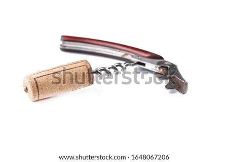 Corkscrew and wine cork isolated on white background.Copy space
