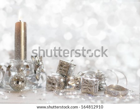 Christmas background with candles, ribbon and gifts