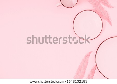 Pink kitchen background. Food concept. Pink plates on pastel pink background. Flat lay, top view, copy space. 