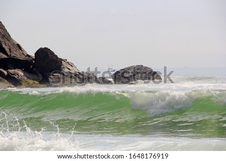 Waves bursting on beach sand