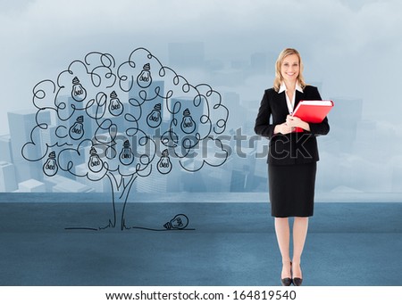Composite image of attractive blonde businesswoman smiling and holding folders