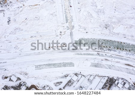 aerial photo of new road under construction. building new street connection. winter season