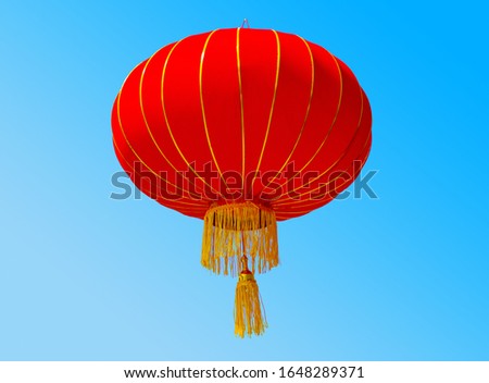 Traditional red chinese new year lantern on blue sky background. Mockup for design, advertising or art creativity. There is a pendant or hook for which you can hang a lantern