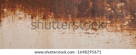 Peeling paint on the rust wall. Empty for design, pattern, cover, overlay texture, background and other, Surface of old steel background. Royalty-Free Stock Photo #1648295671