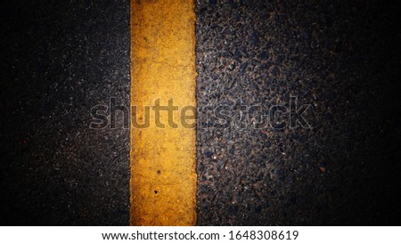 asphalt road and yellow line. concept asphalt background