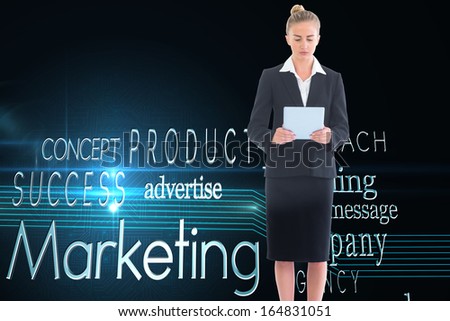 Composite image of blonde businesswoman holding new tablet