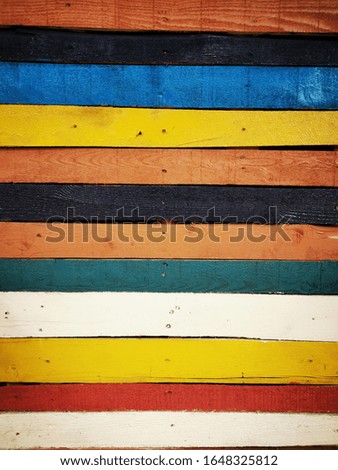 multicolored wooded fence horizontal planks with many patterns and design variations