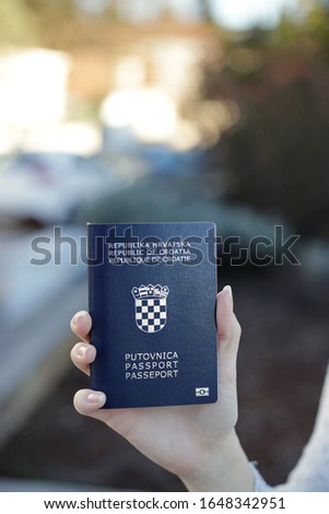 Croatian passport in gril's hand
