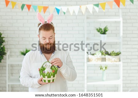 Happy easter. Funny male bearded man smiling on easter background