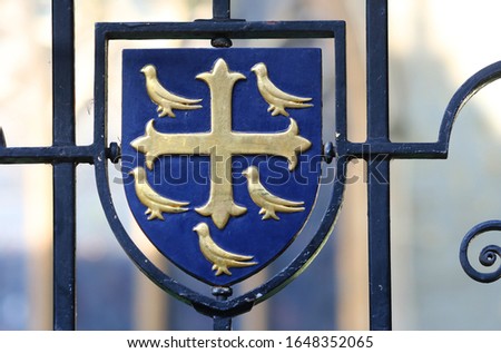 heraldic crest or coat of arms of University College Oxford, also the coat of arms of Edward the Confessor son of Alfred the Great although the college was founded by William of Durham Royalty-Free Stock Photo #1648352065