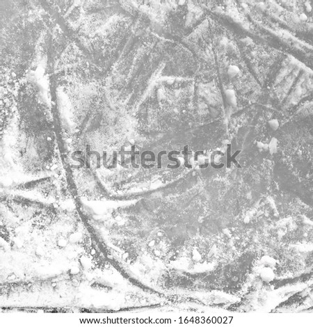 Ice rink floor, detail of a textured background ice. Sports and seasons.