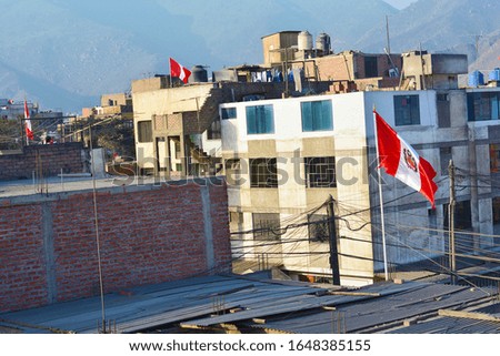Peruvian flag on houses in Lima. Independence day.