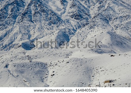 picture of a barren mountain in himalaya covered with snow and making a beautiful unique texture