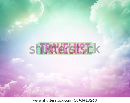 Travelust word on pink and blue pastel sky background