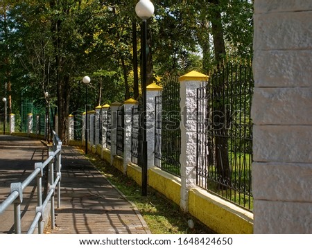 sidewalk along the fence of the Park in summer, Moscow