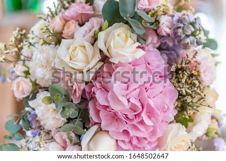 Close up of pink and lilac wedding bouquet. Wedding decoration. Bride's wedding bouquet. Special event table set up. Fresh flower decoration. 
