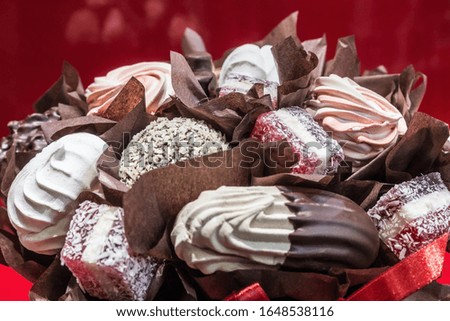 marshmallows, souffles, chocolate, candy and other sweets made up in a bouquet