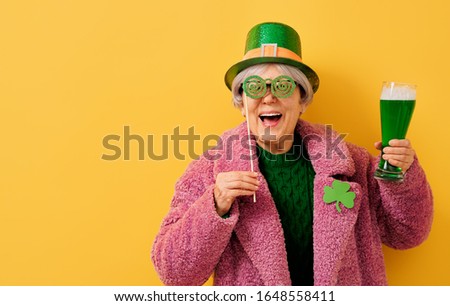 The senior woman in leprechaun hat for a Saint Patrick's Day.                               
