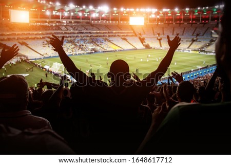 Football, soccer fan support their team and celebrate goal, score, victory. Black silhouette Royalty-Free Stock Photo #1648617712