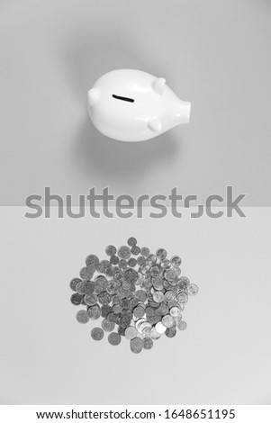 Piggy bank with growth coins against blank background