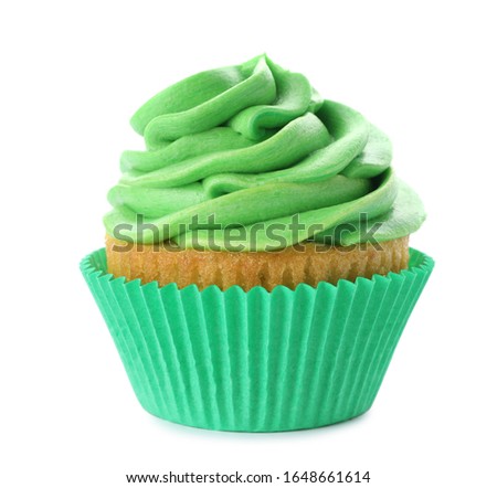 Delicious birthday cupcake decorated with green cream isolated on white
