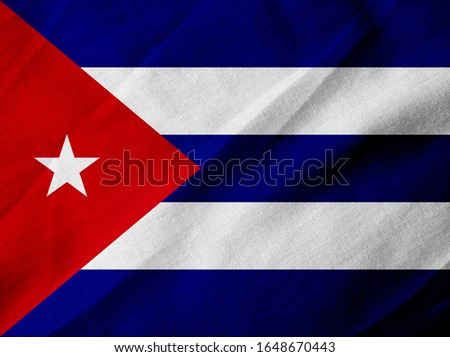Flag of Cuba on creased fabric background