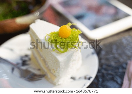 Coconut cake on the table in restaurant. Soft picture