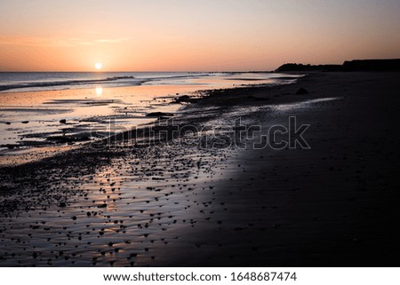 A picture of the coast taken early in the morning when the sun was rising 