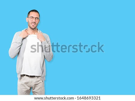 Depressed young man doing a gesture of stress