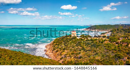 Sunny spring scene of Gargano National Park. Beautiful morning view of Torre di San Felice tower in Apulia region, Italy, Europe. Picturesque seascape of Adriatic sea. Traveling concept background.