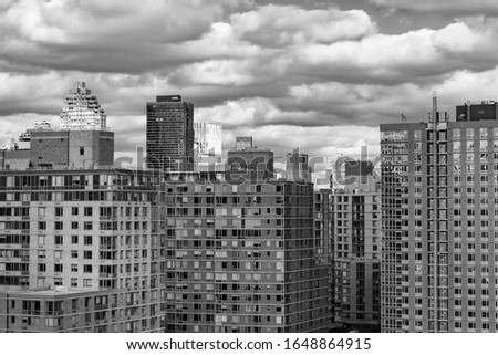Black and White Photo with Roosevelt Island Skyscrapers in New York City with Clouds