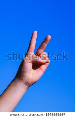 Japanese hand gesture ( v sign )