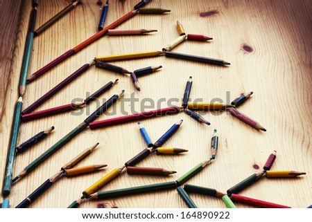 christmas card whit colorful pencils as tree branches/xmas concept/ background with pencils