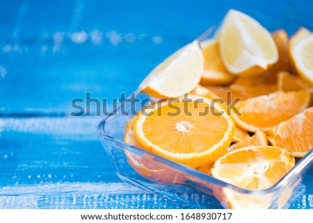 citrus fruits  orange and lemons on blue background