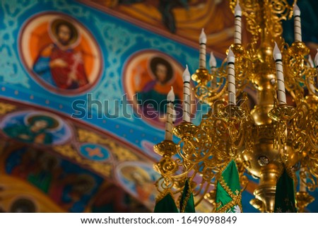 golden electric candelabrum in orthodox church