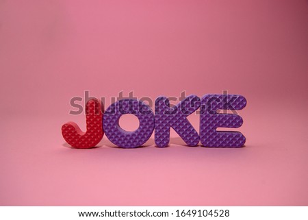The word joke made of magnetic polystyrene letters
