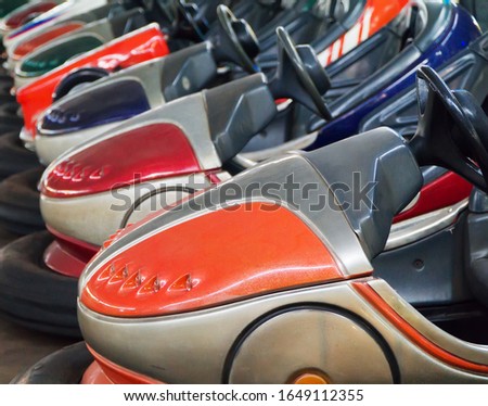 Bumper cars in the city amusement park at evening.
