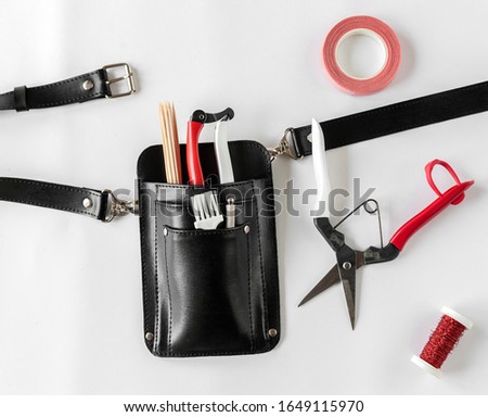 Bag - organizer with garden tools on a white background Royalty-Free Stock Photo #1649115970
