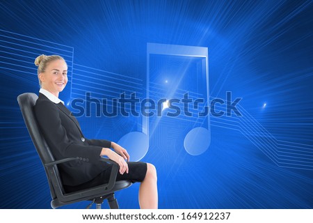 Composite image of attractive blonde businesswoman sitting in swivel chair