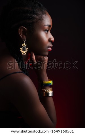 Colorful side view portrait of native african woman