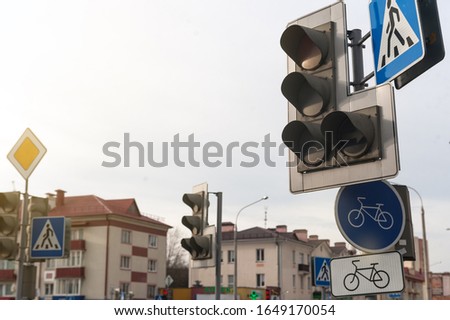 traffic signs and traffic light in the city at the crossroads