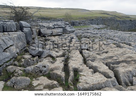 Capturing the limestone causeway at the top of Malham Cove, weathered by footfall and the passage of water.