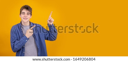 young teenager or student boy isolated on color background