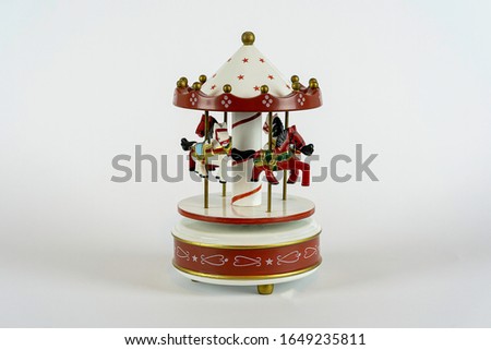 white carousel horse toy on white background home decoration