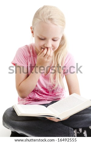 Young girl reading funny book over white background