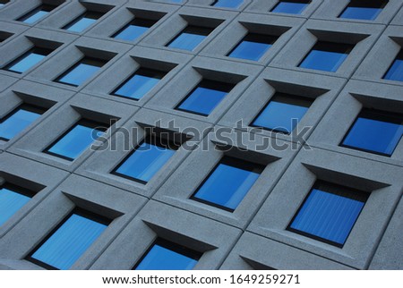 Windows of modern office building symmetrical facade.