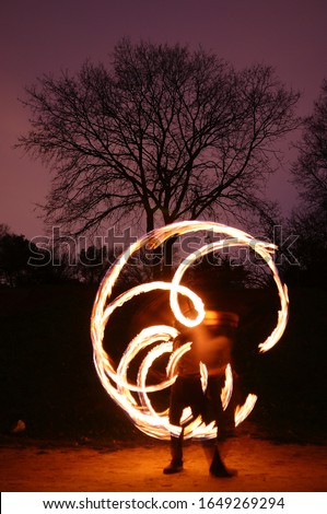 Poi performance with fire and pattern