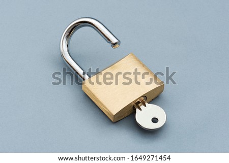 Unlocked Padlock on the gray background. Royalty-Free Stock Photo #1649271454
