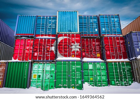 The national flag of Azerbaijan
 on a large number of metal containers for storing goods stacked in rows on top of each other. Conception of storage of goods by importers, exporters