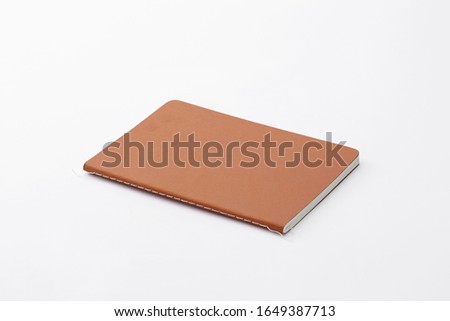 Top view of closed stitch blank recycled paper cover notebook on white background additional clipping path.